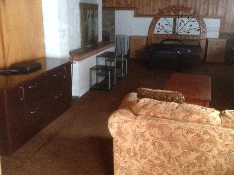 bed area and fireplace
