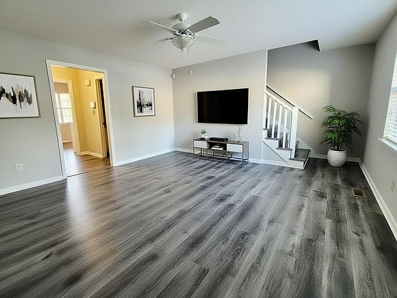 Spacious living room with plenty of natural light and a versatile layout.