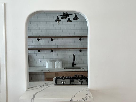 New quartz counter with cafe overhang. Have your coffee here!