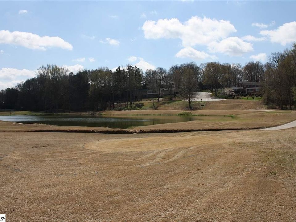 View from the back of the lot looking at the golf course and pond