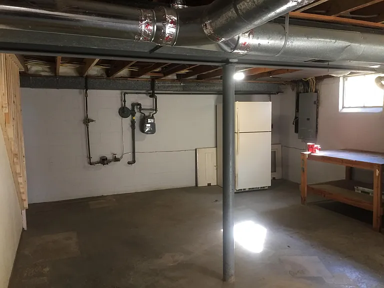 Full basement - unfinished - with extra Refrigerator