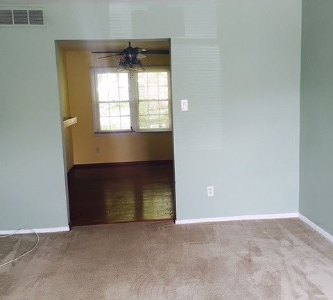 Living room and dining space in the back.