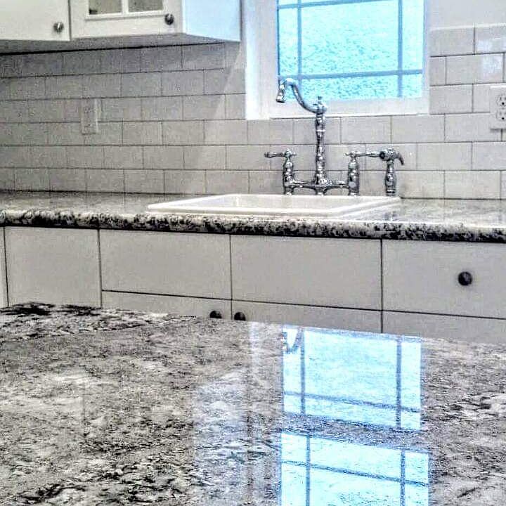 Crome sink fixture with window to look out to your completed fenced yard. High end Granite finishes.