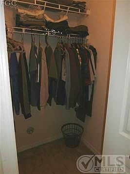 1 of 2 walk in closets in mastr bedroom