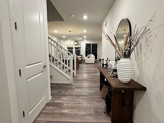 Foyer/entry way including large coat closet with walk-in storage space
