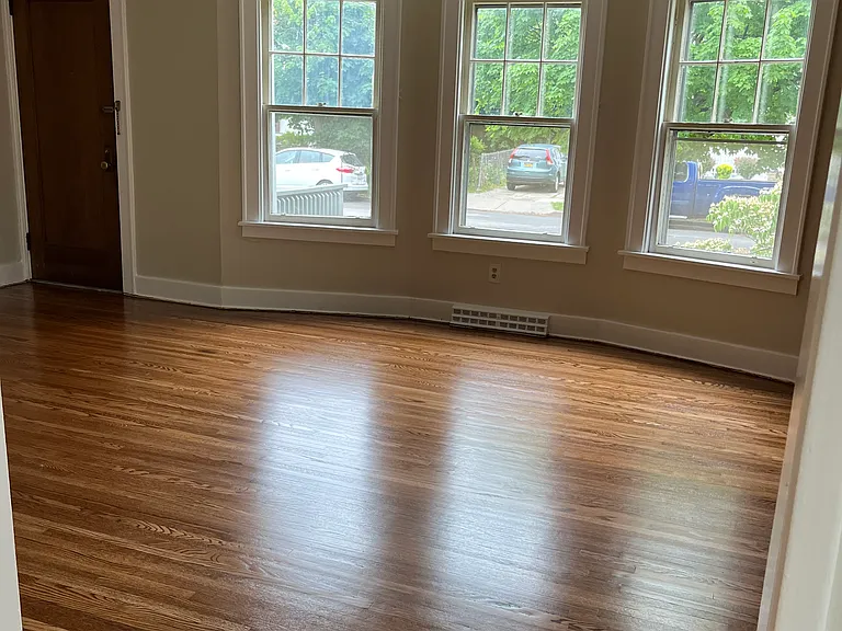 Spacious living room with new front windows