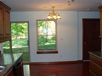 eating area in the kitchen overlooking the backyard