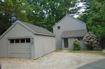 1 Car Garage, with door in rear. 3 spots additional on driveway.