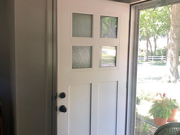 New front and back doors including storm door.