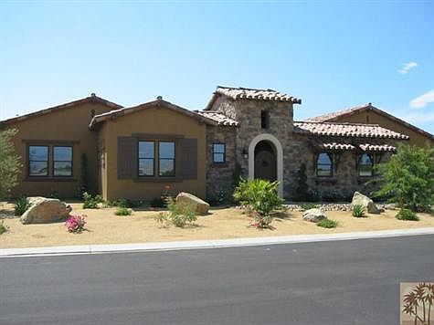 This is a photo of the Model home which is the same floor plan and exterior elevation. The difference being there is a casita added on the front of this model. to the left of the tower. There are two other color palettes from which to choose on the Tuscan exterior, or there is a Spanish Colonial elevation with its own three color palettes as well.