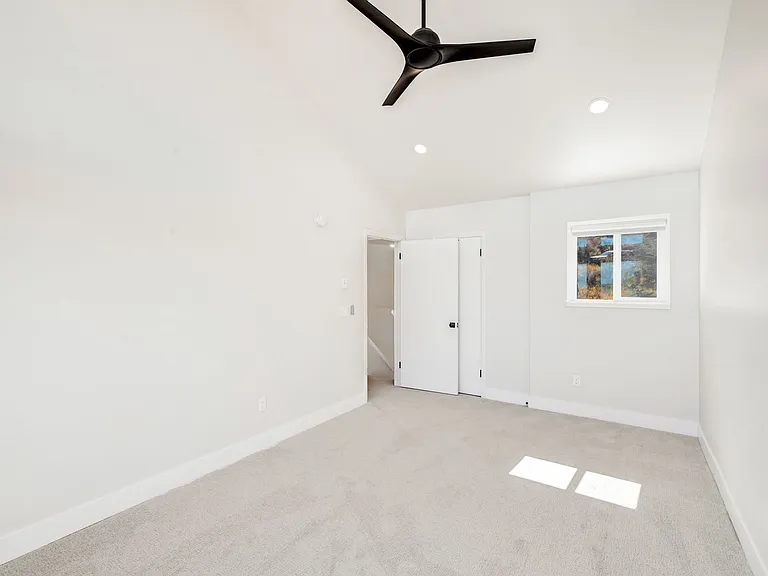 Bedroom #2 - on upper level. Floor to ceiling windows with electric black out window shades.