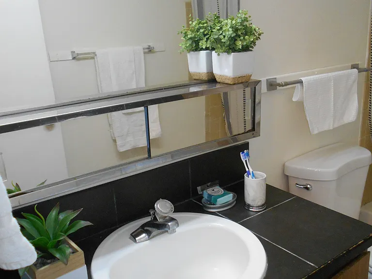 The two bedrooms share the full bath on the top floor.