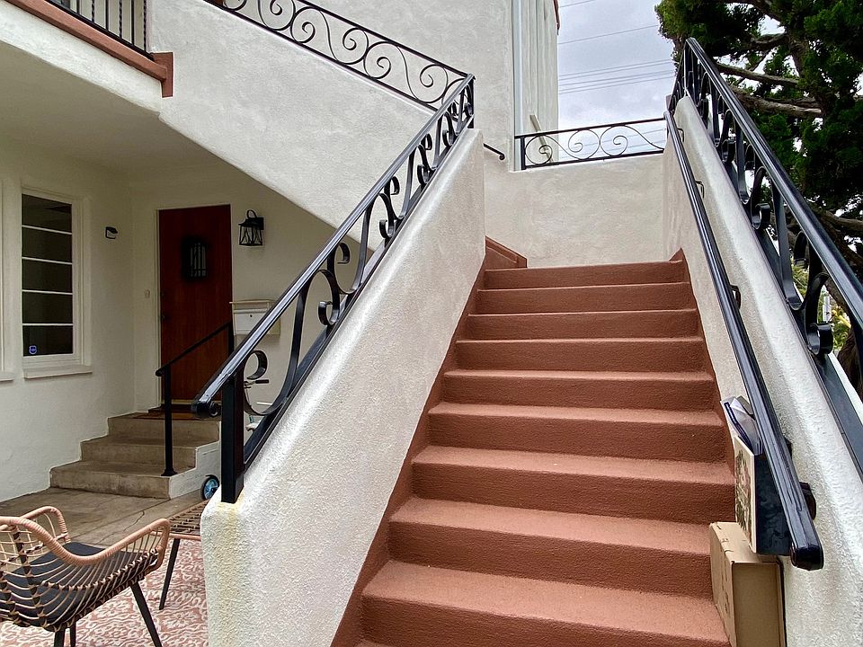 stairs leading up to unit - waterproofed, painted, and new ironwork