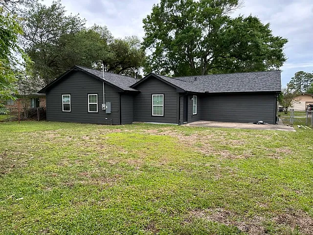 Large backyard with plenty of space to relax, entertain, or make it your own.