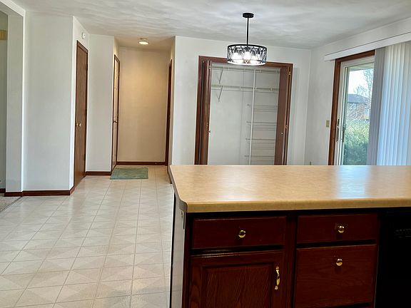 Access to the basement and garage from the large kitchen and dining room area, with a full bathroom on the main floor.
