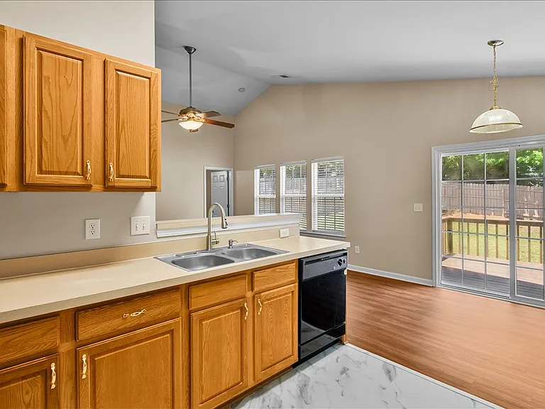 Kitchen and dining area with view of deck