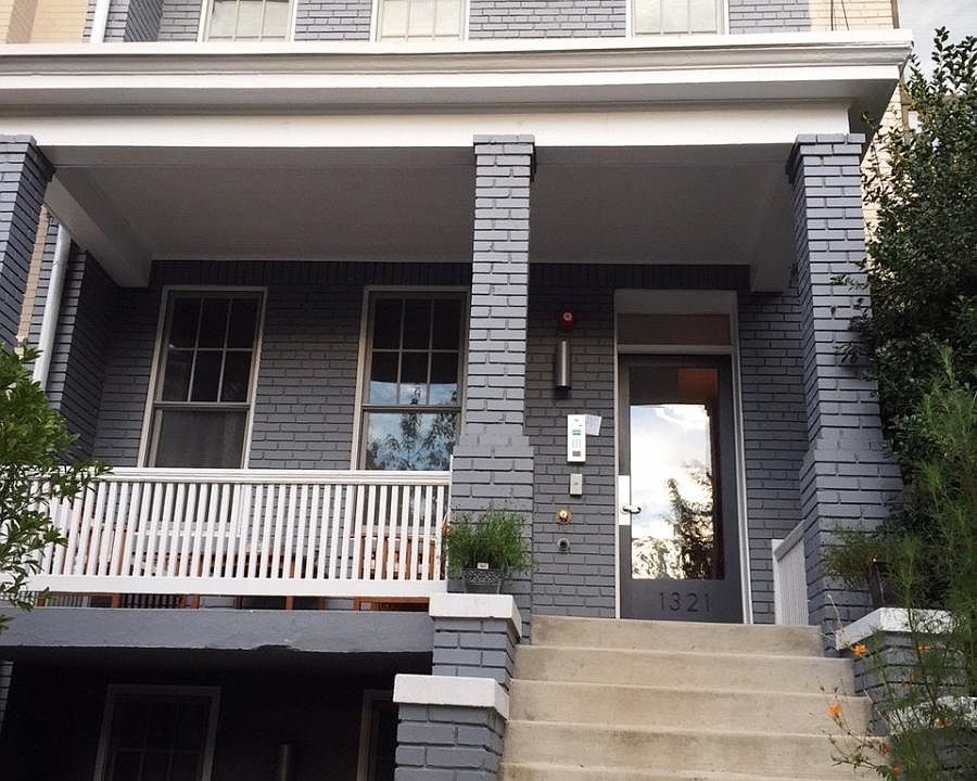 The rowhouse sits on a quiet residential street in Dupont Ci