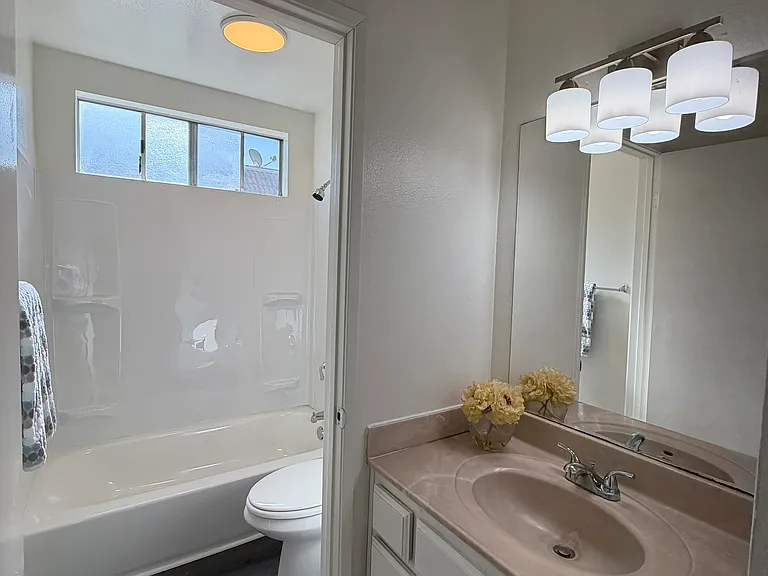 Bathroom 2 has shower and toilet room and sink outside
