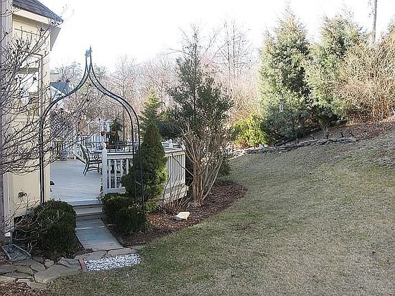 Beautiful back yard, with large deck - privacy plantings and perennials!