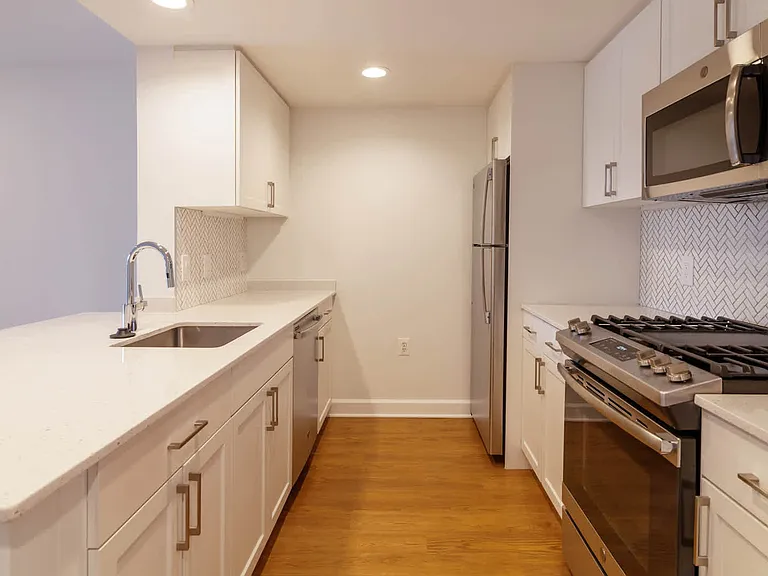 Kitchen with Gas Stove, Stainless Steel Appliances and Quartz Countertops