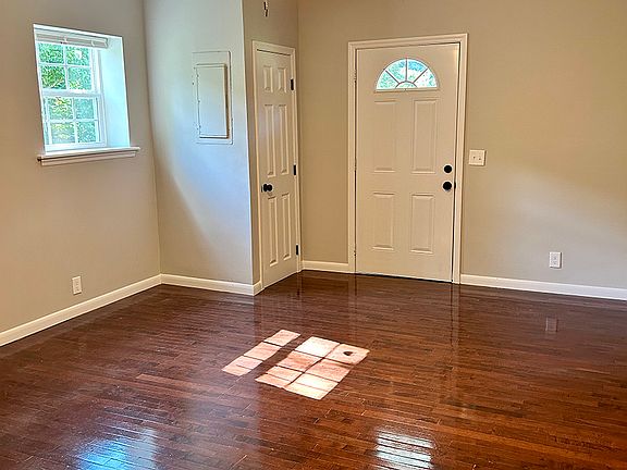 Living Room:
New Windows and Entry Doors Throughout, Refinished Hardwood