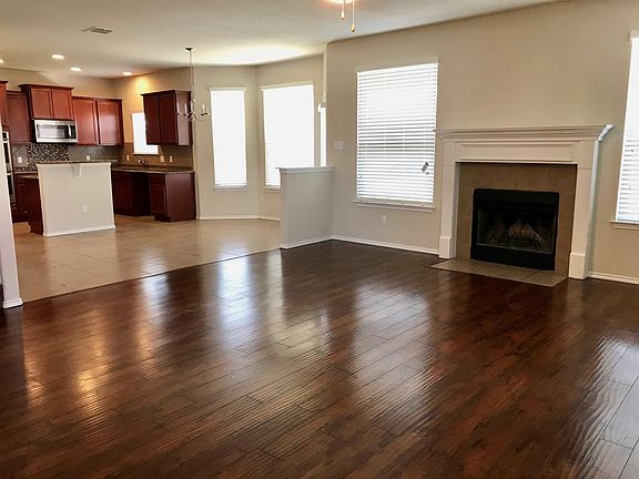 Living room/fireplace/kitchen