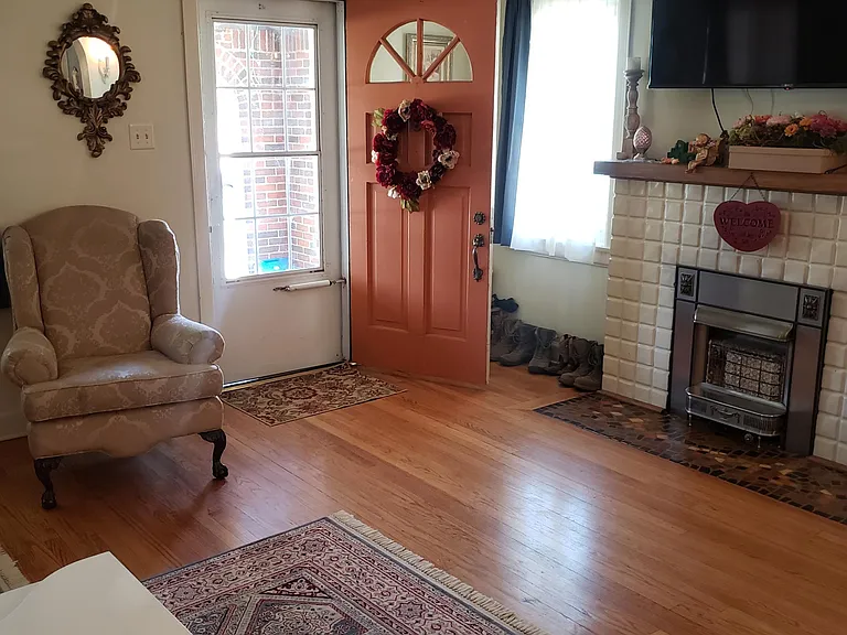 Living room with front door facing west