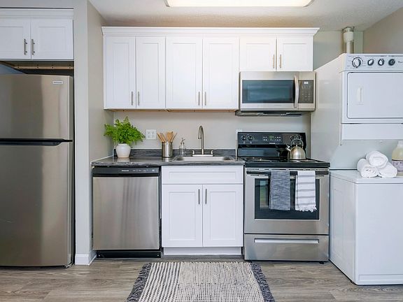Discover the perfect kitchen with abundant cabinetry and storage as well as an in-unit washer & dryer for effortless living.