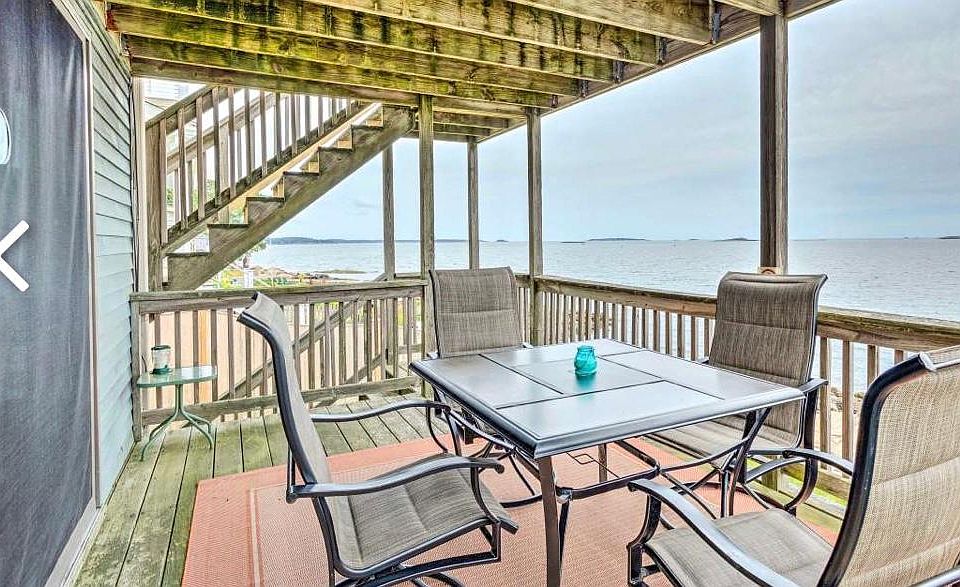 Deck has been updated since this pic and is gorgeous!! The unit has its own private deck off the living room with ocean views!