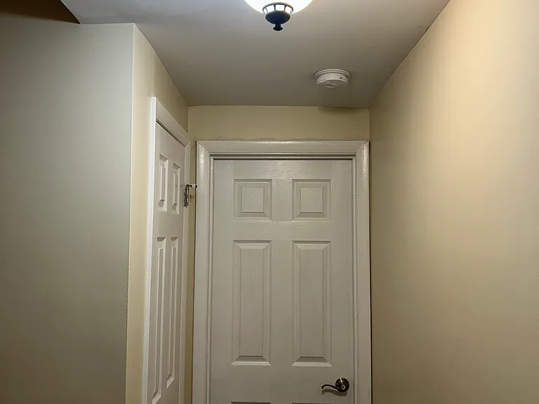 Basement hallway (storage area to the left)