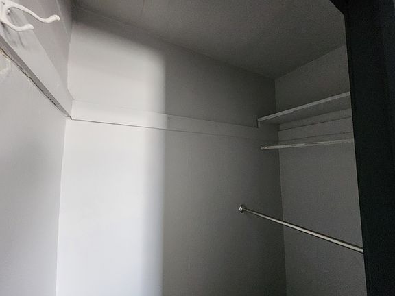 Deep private closet with double bars, shelf, hooks!