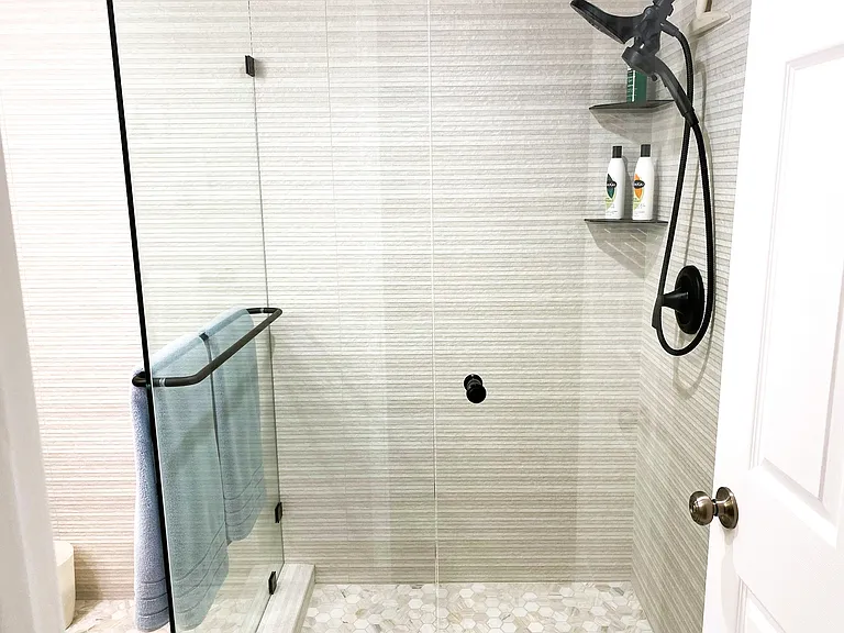 beautiful large porcelain tile shower with dual shower heads