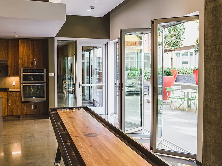 Open the folding glass doors and compete in a game of shuffleboard