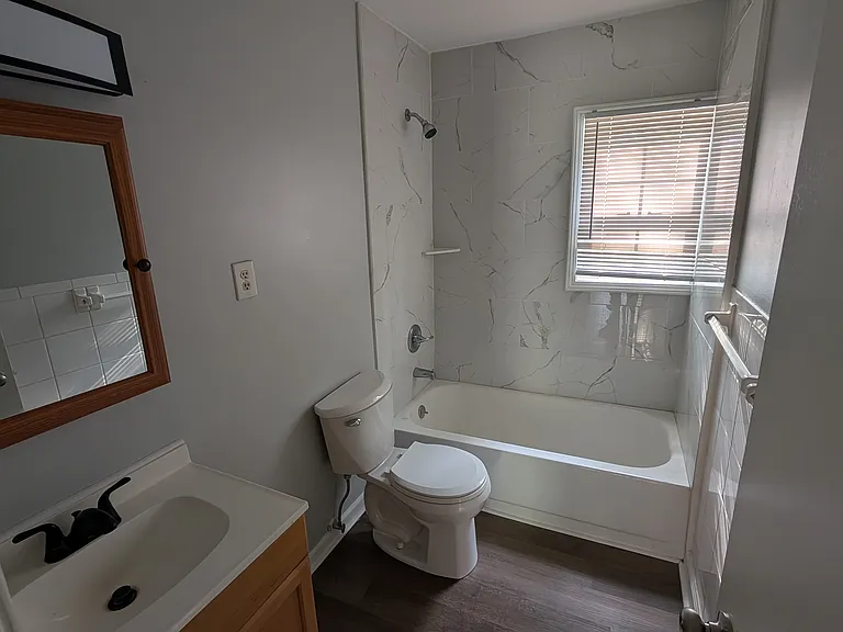 Full bath, features tile walls