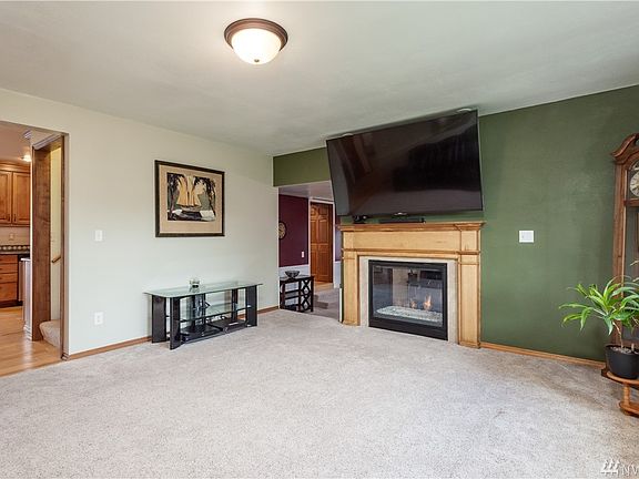 Living room connects to kitchen and family room