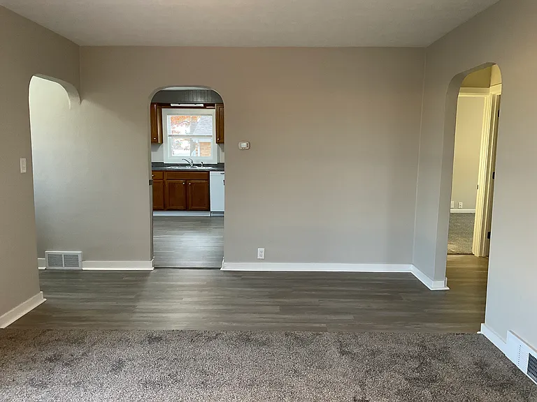 Entry from living room into kitchen. Could use space for a desk possibly