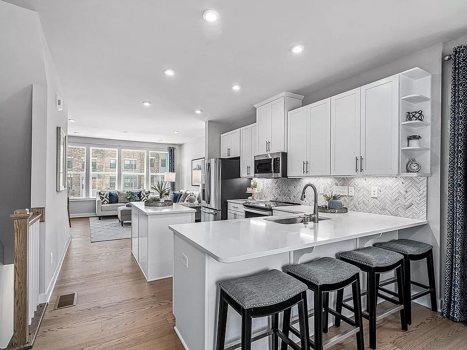 Gourmet Kitchen With Premium Quartz Countertops, Breakfast Bar and Island