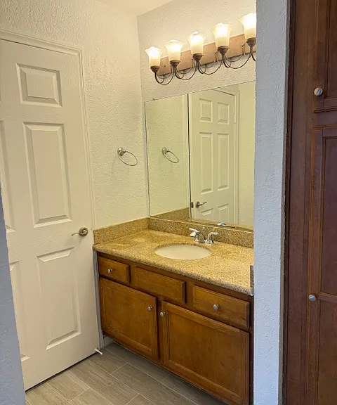 Master dressing area adjacent to walk in closet