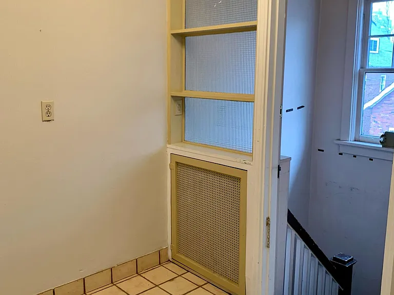 Stairs leading down to basement/laundry area