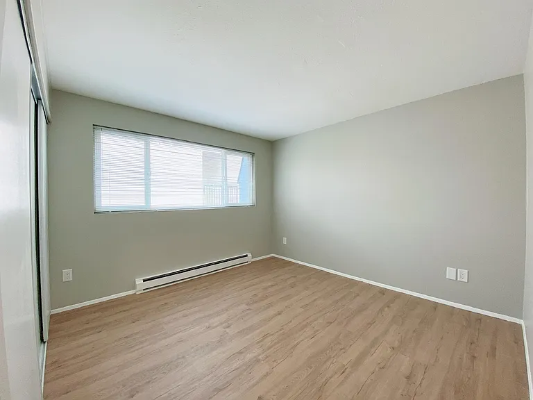 Space can easily accommodate a large double/queen bed with desk. Large windows lets in great natural light.