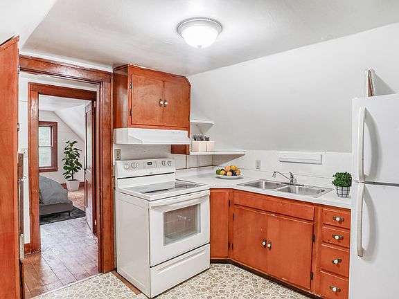 Kitchen featuring a stove and fridge