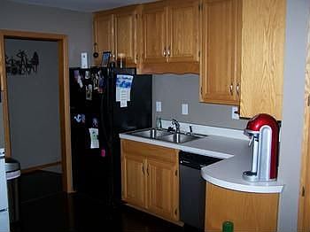 Kitchen with updated cabinets and appliances.
