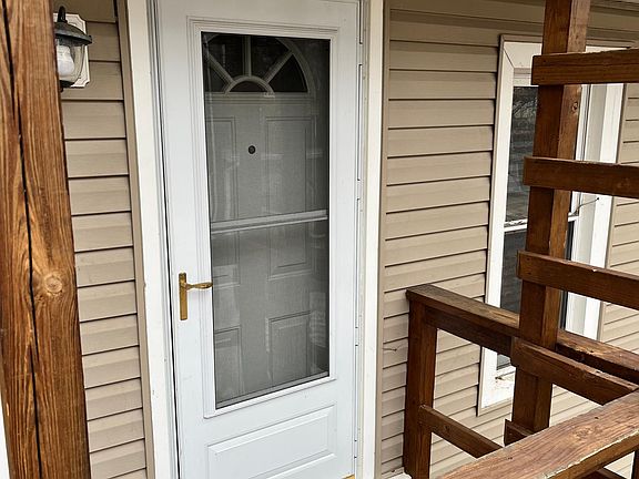 Front entrance with porch light.