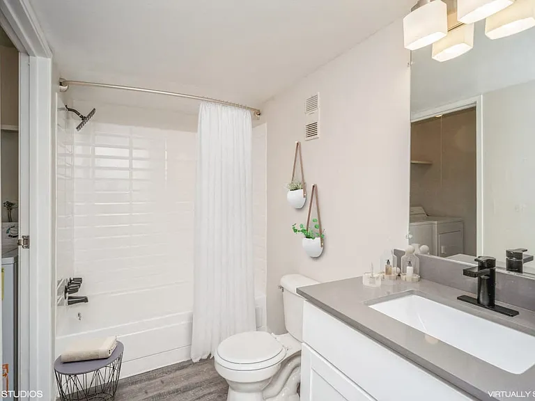 Beautiful white bathrooms with mirror and counter space