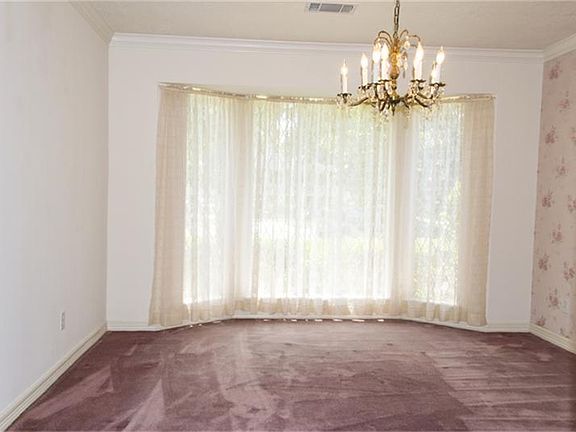 The formal dining room is generous enough in size for a large dining room table.