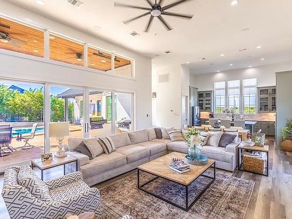 Beautiful Open Concept Design with Tall Ceilings and Patio Doors to the Outdoor Entertaining Areas.