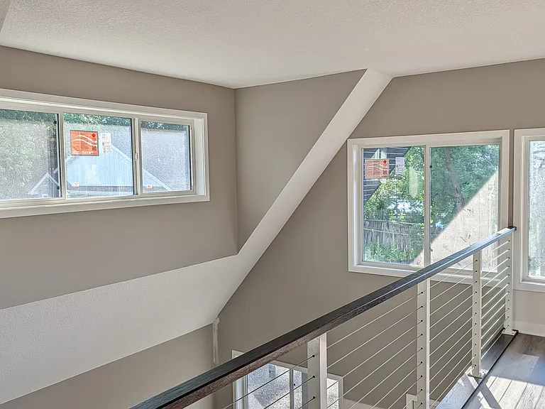 Half-loft above the kitchen has lots of natural light and water and first views.