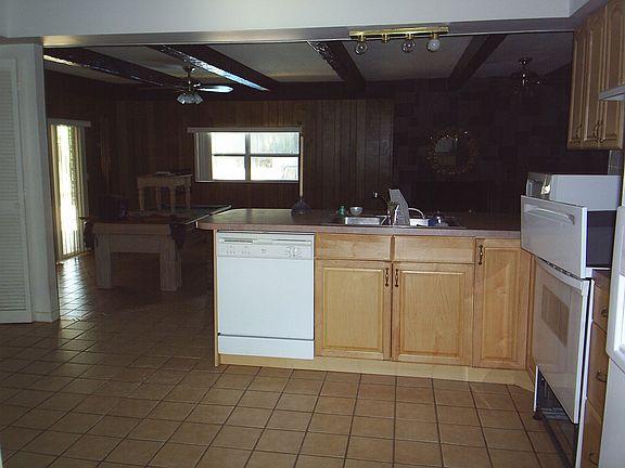 Kitchen looking out to family and pool