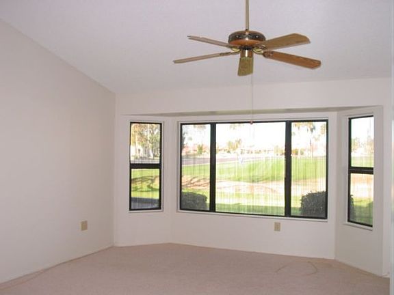 Large master bedroom with with bay window.
