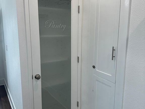 Pantry and ironing board cabinet